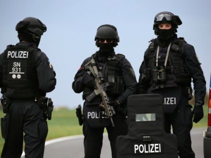 Policemen secure the area between Wiedersdorf and Landsberg near Halle, eastern Germany, where shots were fired on October 9, 2019. - At least two people were shot dead on October 9, 2019 on a street in Halle, police said, with witnesses saying that the synagogue was among the gunmen's targets …