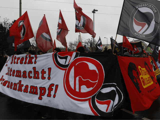 BERLIN, GERMANY - JANUARY 13: A procession including a wide range of Berlin's radical leftist activists march to Friedrichsfelde cemetery to commemorate the 100th anniversary of the murder of Rosa Luxemburg and Karl Liebknecht on January 13, 2019 in Berlin, Germany. Luxemburg and Liebknecht founded Germany's Communist Party (KPD) shortly …