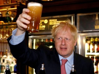 LONON, ENGLAND - JULY 10: Boris Johnson, a leadership candidate for Britain's Conservative Party holds a pint of beer as he meets with JD Wetherspoon chairman, Tim Martin at Wetherspoons Metropolitan Bar on July 10, 2019 in London, England. (Photo by Henry Nicholls WPA Pool/Getty Images)