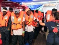 Boat Migrants Landed on European Soil After Threatening to Blow Up Holding Ship