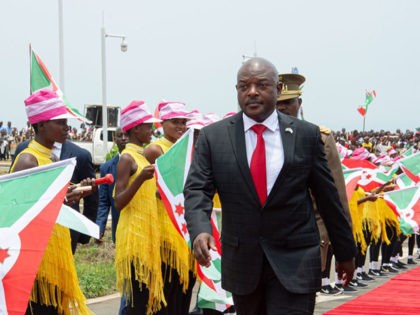 Burundi's President Pierre Nkurunziza (R) walks on the red carpet as he arrives to inaugur