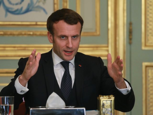 French president Emmanuel Macron speaks during a call conference to install the CARE commi