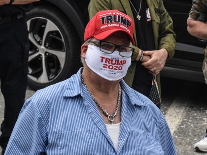 CARMEL, NY - MAY 25: A person wears a protective mask that reads "Trump 2020" before parti