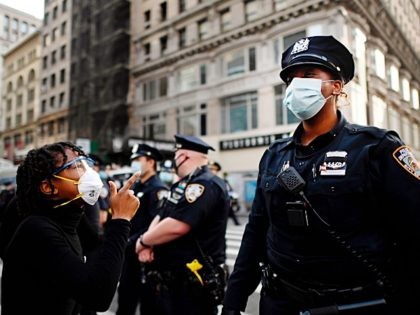 TOPSHOT - Protestors shout in front of NYPD officers during a "Black Lives Matter" demonstration on May 28, 2020 in New York City, in outrage over the death of a black man in Minnesota who died after a white policeman kneeled on his neck for several minutes. - Concern and …