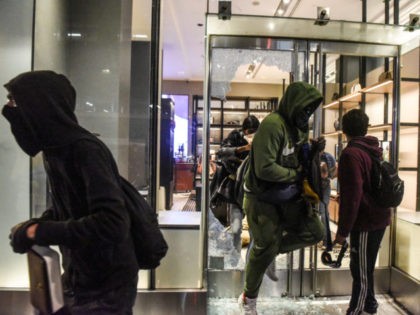 EW YORK, NY - MAY 31: People vandalize a Coach store on May 31, 2020 in New York City. Maj