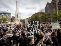 Protesters demonstrate on June 1, 2020 in Amsterdam, to protest against the police killing of unarmed black man George Floyd in the USA. - The United States has erupted into days and nights of protests, violence, and looting, following the death of George Floyd after he was detained and held …