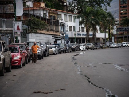 CARACAS, VENEZUELA - JUNE 01: A long line of cars awaiting to put gas in an international