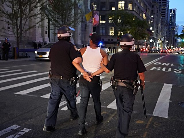 A person is arrested and walked down 5th Avenue near St. Patricks on June 1, 2020, in New York City, during a "Black Lives Matter" protest. - New York's mayor Bill de Blasio today declared a city curfew from 11:00 pm to 5:00 am, as sometimes violent anti-racism protests roil …