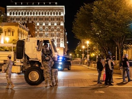 WASHINGTON, DC - JUNE 1: Members of the National Guard block an intersection after a demon