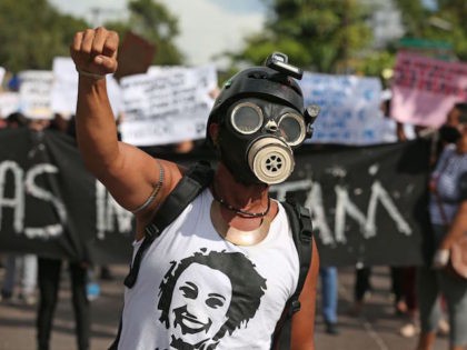 Demonstrators against Brazilian President Jair Bolsonaro's government, protest during an a
