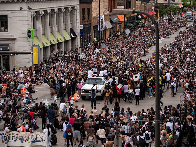 MINNEAPOLIS, MN - JUNE 6: Demonstrators calling to defund the Minneapolis Police Department pause on Hennepin Avenue on June 6, 2020 in Minneapolis, Minnesota. The march, organized by the Black Visions Collective, commemorated the life of George Floyd who was killed by members of the MPD on May 25. (Photo …