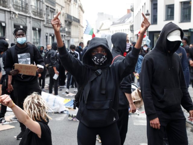 Protesters demonstrate during an anti-racism protest, in Brussels, on June 7, 2020, as part of a weekend of 'Black Lives Matter' worldwide protests against racism and police brutality in the wake of the death of George Floyd, an unarmed black man killed while apprehended by police in Minneapolis, US. (Photo …