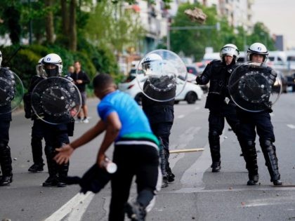 A protestor scuffle with Police officers in riot gear during an anti-racism protest, in Brussels, on June 7, 2020, as part of a weekend of 'Black Lives Matter' worldwide protests against racism and police brutality in the wake of the death of George Floyd, an unarmed black man killed while …