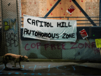 SEATTLE, WA - JUNE 09: A "Capitol Hill Autonomous Zone" sign hangs on the exterior of the Seattle Police Departments East Precinct on June 9, 2020 in Seattle, Washington. Protests have continued in many parts of the city including inside City Hall and around the Seattle Police Departments East Precinct, …