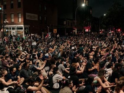 NEW YORK, NY - JUNE 11: Protesters kneel at an intersection to demand an end to systemic racism and police brutality in the borough of Brooklyn on June 11, 2020 in New York City. Demonstrations against systemic racism have continued for over two weeks since the killing of George Floyd, …