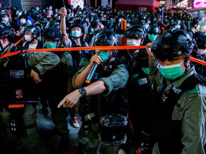 TOPSHOT - Police conduct a clearing operation as protesters gathered in the Mong Kok distr