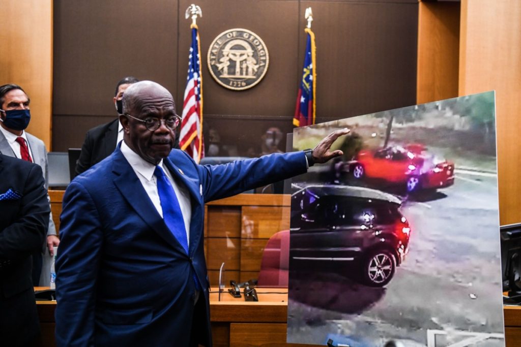 Fulton County District Attorney Paul L. Howard Jr. point at a picture displayed inside the courtroom as he announces 11 charges against former Atlanta Police Officer Garrett Rolfe on June 17, 2020, in Atlanta, Georgia. - An Atlanta police officer will be charged with murder for shooting a 27-year-old man in the back, justice officials announced June 17 in the latest case to spark anger over police killings of African Americans. (Photo by CHANDAN KHANNA / AFP) (Photo by CHANDAN KHANNA/AFP via Getty Images)