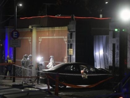 View of scientific police next to the car which deliberately crashed into the entrance of China's embassy in Buenos Aires, Argentina, on June 22, 2020 during the lockdown imposed by the government against the spread of the new coronavirus, COVID-19. - According to local media, the driver was identified as …