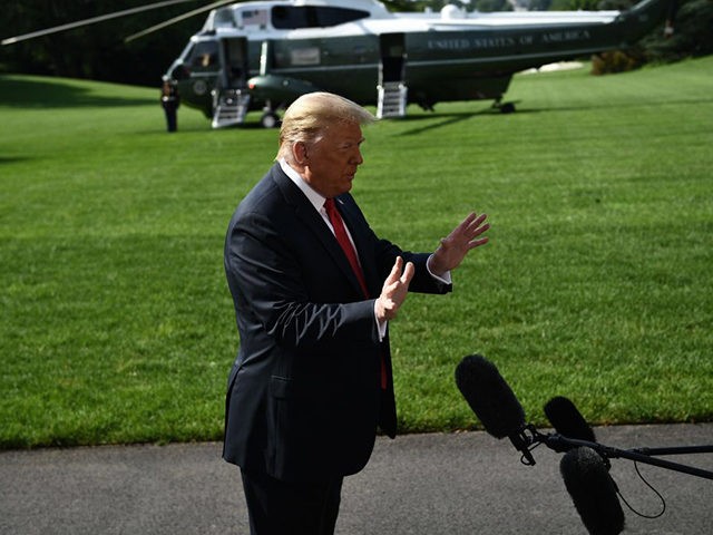 US President Donald Trump speaks to the media on the South Lawn of the White House before departing, en route to Arizona on June 23, 2020 in Washington,DC. (Photo by Brendan Smialowski / AFP) (Photo by BRENDAN SMIALOWSKI/AFUS President Donald Trump speaks to the media on the South Lawn of …