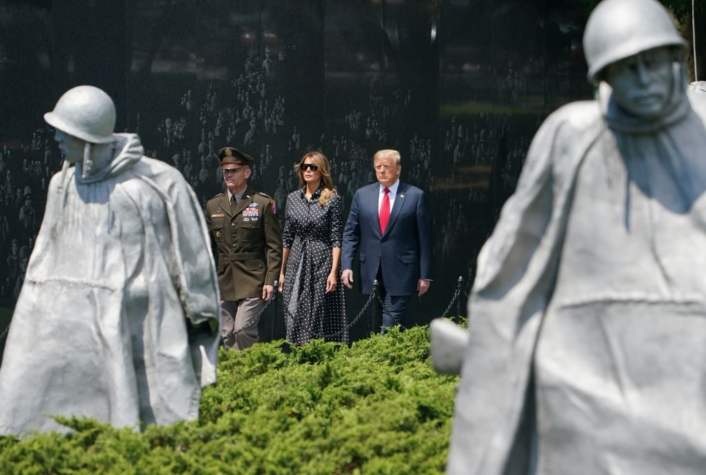 US President Donald Trump and First Lady Melania Trump visit the Korean War Veterans Memorial in Washington, DC on June 25, 2020. - North and South Korea on June 25, 2020 separately marked the 70th anniversary of the start of the Korean War, a conflict that killed millions of people and has technically yet to end.The fighting ended with an armistice that was never replaced by a peace treaty, leaving the peninsula and millions of families split by the Demilitarized Zone. (Photo by MANDEL NGAN / AFP) (Photo by MANDEL NGAN/AFP via Getty Images)