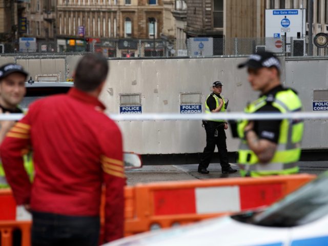 Police officers staff a cordon in central Glasgow on June 27, 2020 following a stabbing in