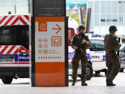 French servicemen patrol in La defense business district, west of Paris on June 30, 2020 a