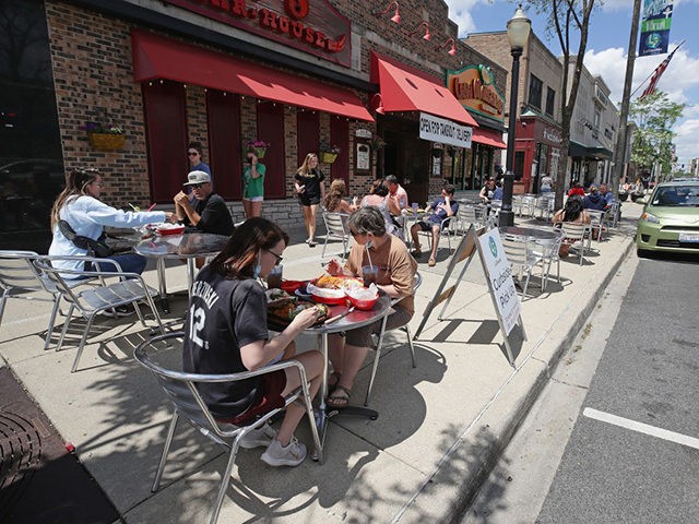 LAGRANGE, ILLINOIS - MAY 29: Diners eat lunch on the sidewalk in front of Casa Margarita r