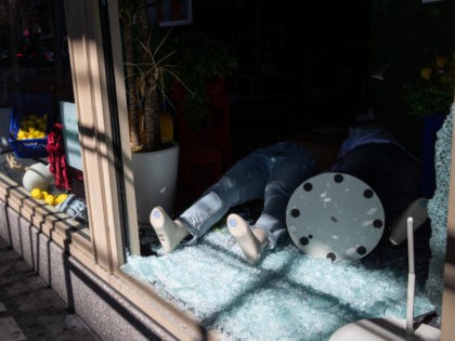 NEW YORK, NEW YORK - JUNE 01: A mannequin lies in broken glass at American Eagle Outfitters in the Soho district of Manhattan on June 01, 2020 in New York City. Cleaning and construction teams worked to board up storefronts of dozens of shops damaged during clashes between police and …