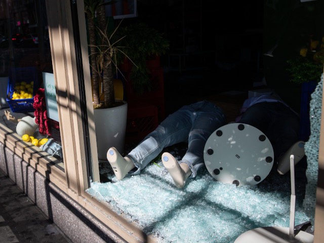 NEW YORK, NEW YORK - JUNE 01: A mannequin lies in broken glass at American Eagle Outfitter
