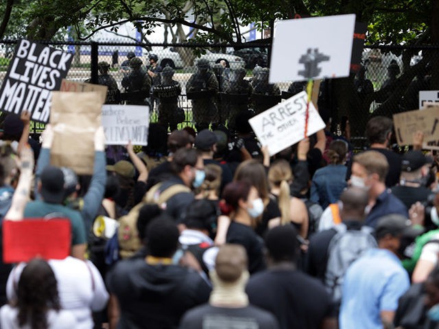 WASHINGTON, DC - JUNE 02: Members of the D.C. National Guard watch as demonstrators protes