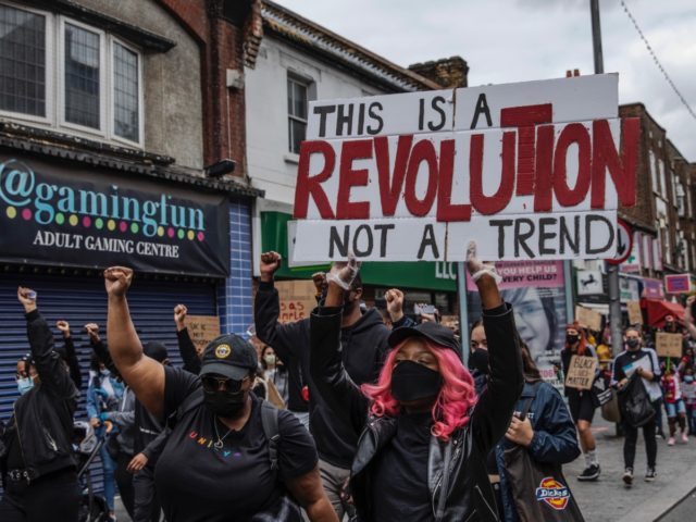 BARKING, ENGLAND - JUNE 09: A Black Lives Matter protest takes place in Barking town centre on June 09, 2020 in Barking, United Kingdom. The death of an African-American man, George Floyd, while in the custody of Minneapolis police has sparked protests across the United States, as well as demonstrations …