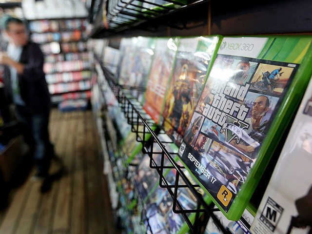 NEW YORK, NY - SEPTEMBER 18: A display copy of Grand Theft Auto V (R) sits on a shelf at the 8 Bit & Up video games shop in Manhattan's East Village on September 18, 2013 in New York City. The video game raked in more than $800 million in …