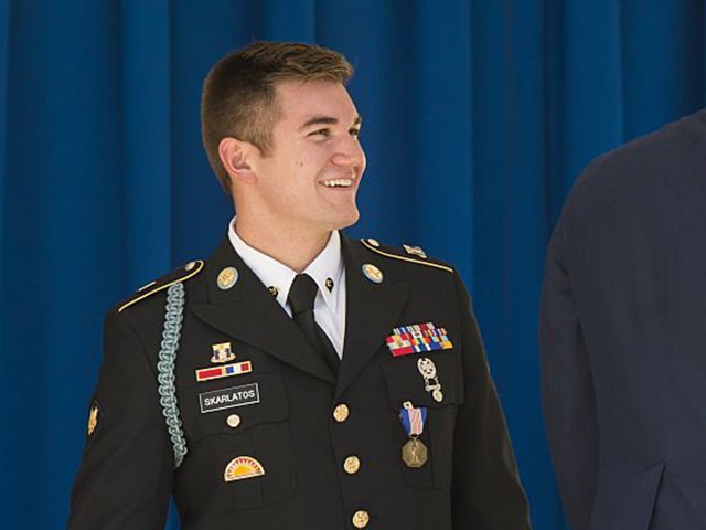 Airman 1st Class Spencer Stone (C), and Anthony Sadler (R) embrace alongside Army Specialist Alek Skarlatos (L) after they received awards for their roles in disarming a gunman on a Paris-bound train last month during a ceremony at the Pentagon in Washington, DC, September 17, 2015. Stone received the Airman's Medal and a Purple Heart, Skarlatos received the Soldier's Medal and Sadler received the Department of Defense Medal for Valor. AFP PHOTO / SAUL LOEB (Photo credit should read SAUL LOEB/AFP via Getty Images)