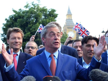 Leader of the United Kingdom Independence Party (UKIP), Nigel Farage (C) speaks during a p