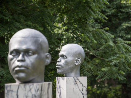 Sculptures by Thomas J. Price entitled 'Numen (Shifting Votive One, Two and Three)' on July 4, 2017 in Regent's Park, London
