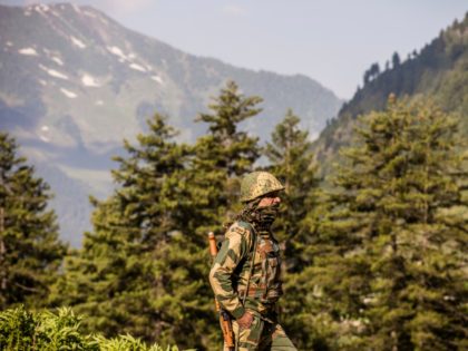 GAGANGIR, KASHMIR, INDIA - JUNE 19: An Indian Border Security Force (BSF) soldier guards a