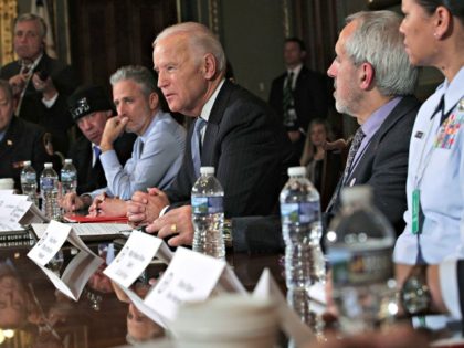 WASHINGTON, DC - DECEMBER 13: U.S. Vice President Joe Biden speaks during a roundtable on the Cancer Moonshot Initiative as comedian Jon Stewart looks on December 13, 2016 at Eisenhower Executive Office Building in Washington, DC. Biden held a roundtable to discuss military and first responder care. (Photo by Alex …
