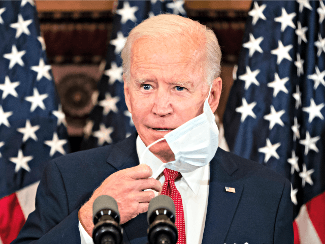 Democratic presidential candidate, former Vice President Joe Biden removes his mask as he speaks in Philadelphia, Tuesday, June 2, 2020. (AP Photo/Matt Rourke)
