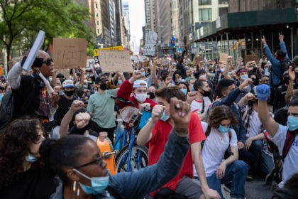 NEW YORK, NEW YORK - MAY 31: Black Lives Matter protesters kneel to honor George Floyd in Midtown Manhattan on May 31, 2020 in New York City. Protesters demonstrated for the fourth straight night after video emerged of a Minneapolis police officer, Derek Chauvin, pinning George Floyd's neck to the …