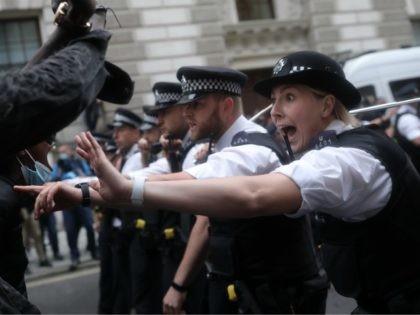 LONDON, ENGLAND - JUNE 03: Police officers gesture to demonstrators during a Black Lives Matter protest on June 3, 2020 in London, United Kingdom. The death of an African-American man, George Floyd, while in the custody of Minneapolis police has sparked protests across the United States, as well as demonstrations …