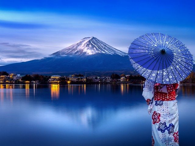 Asian woman wearing japanese traditional kimono at Fuji mountain, Kawaguchiko lake in Japa
