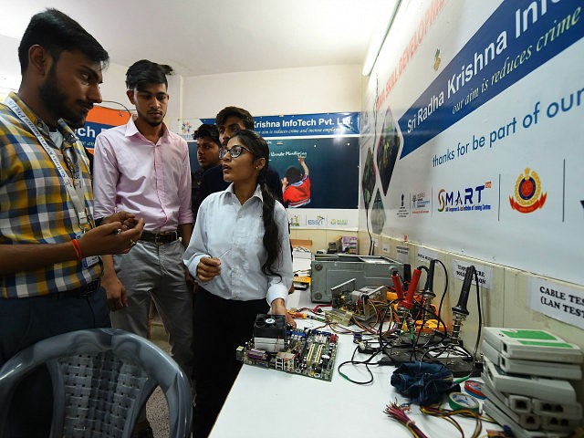 This photo taken on May 22, 2019, shows Indian youths at a class for a three-month course on computer hardware at a training centre run by the National Skill Development Corporation (NSDC) under the Ministry of Skill Development and Entrepreneurship (MSDE) in New Delhi. - Asad Ahmed diligently scribbled notes …