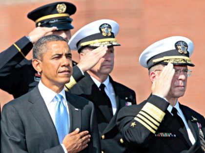 President Barack Obama and retiring Joint Chiefs Chairman Adm. Mike Mullen take part in a