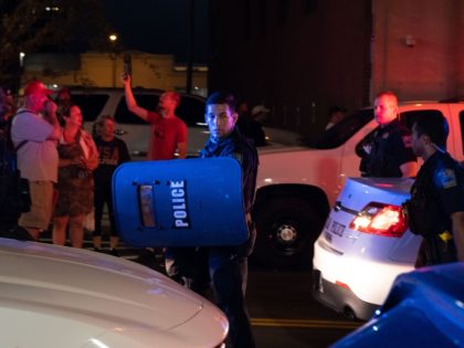 Members of the Tulsa Police Department leave the area after shooting pepper balls at protesters as they march and protest near the BOK Center in Tulsa, Oklahoma on June 20,2020 - Hundreds of supporters lined up early for Donald Trump's first political rally in months, saying the risk of contracting …