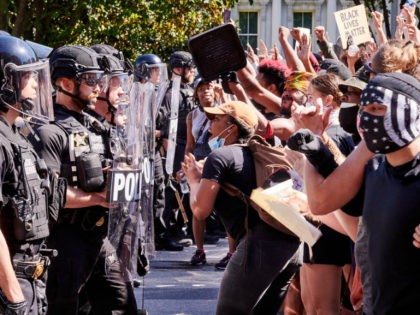 Protestors confront the Secret Service in front of the Old Executive Office Building on Pennsylvania Avenue. Lafayette Park and access to the White House had been barricaded. Protestors were there in a second day of DC protests against the police brutality in the death of George Floyd. However, after days …