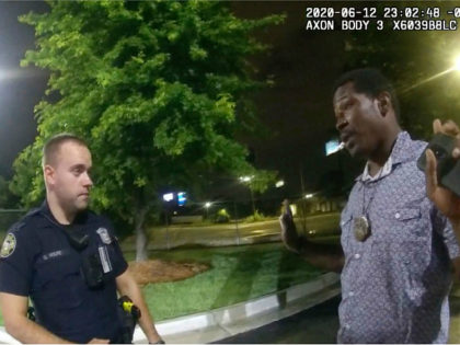 This screen grab taken from body camera video provided by the Atlanta Police Department shows Rayshard Brooks speaking with Officer Garrett Rolfe in the parking lot of a Wendy's restaurant, late Friday, June 12, 2020, in Atlanta. Rolfe has been fired following the fatal shooting of Brooks and a second …
