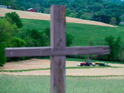 Farmer Dave Burrier plants corn in the Marvin Chapel field in Mount Airy, Maryland on May