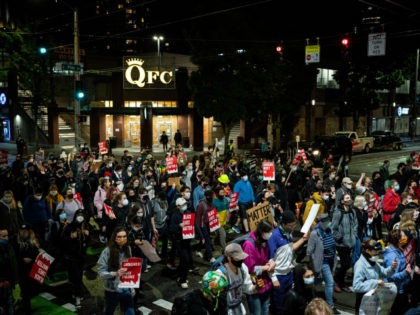 Demonstrators march to the Seattle Police Departments East Precinct after marching inside Seattle City Hall, led by Seattle City Council member Kshama Sawant, on June 9, 2020 in Seattle, Washington. Protests have continued in many parts of the city including around the Seattle Police Departments East Precinct, an area that …