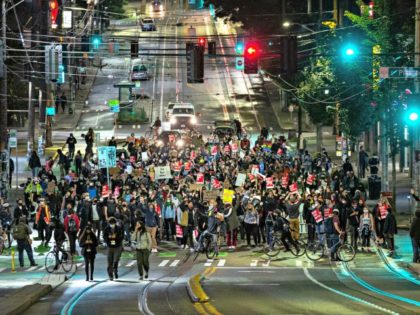 SEATTLE, WA - JUNE 09: Demonstrators march to the Seattle Police Departments East Precinct