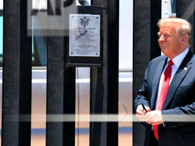 President Donald Trump smiles after autographing a section of the border wall during a tour, Tuesday, June 23, 2020, in San Luis, Ariz. (AP Photo/Evan Vucci)